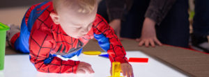 visually impaired toddler interacting with light box