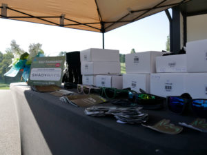 Shady Rays sunglasses on a table. The sunglasses were the tee gifts for the participating golfers.