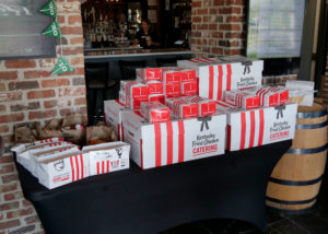 A stack of box lunches provided by KFC.