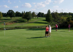 Diane Nelson's team on the putting green.