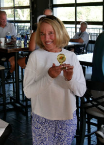 Maxine Bizer poses for a photo with the Turtle Award.