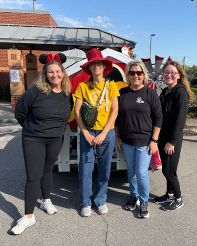 VIPS team members Kelly Easton, Lesley Lusher, Tammy Maynard, and Christina Welsh pose for a photo.