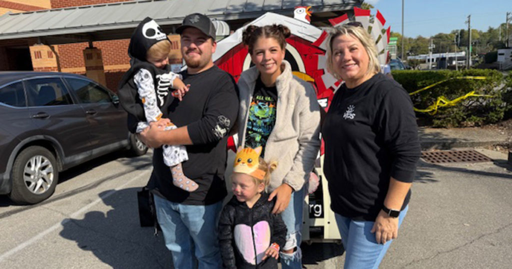 Tammy Maynard and a VIPS family of four pose for a photo.