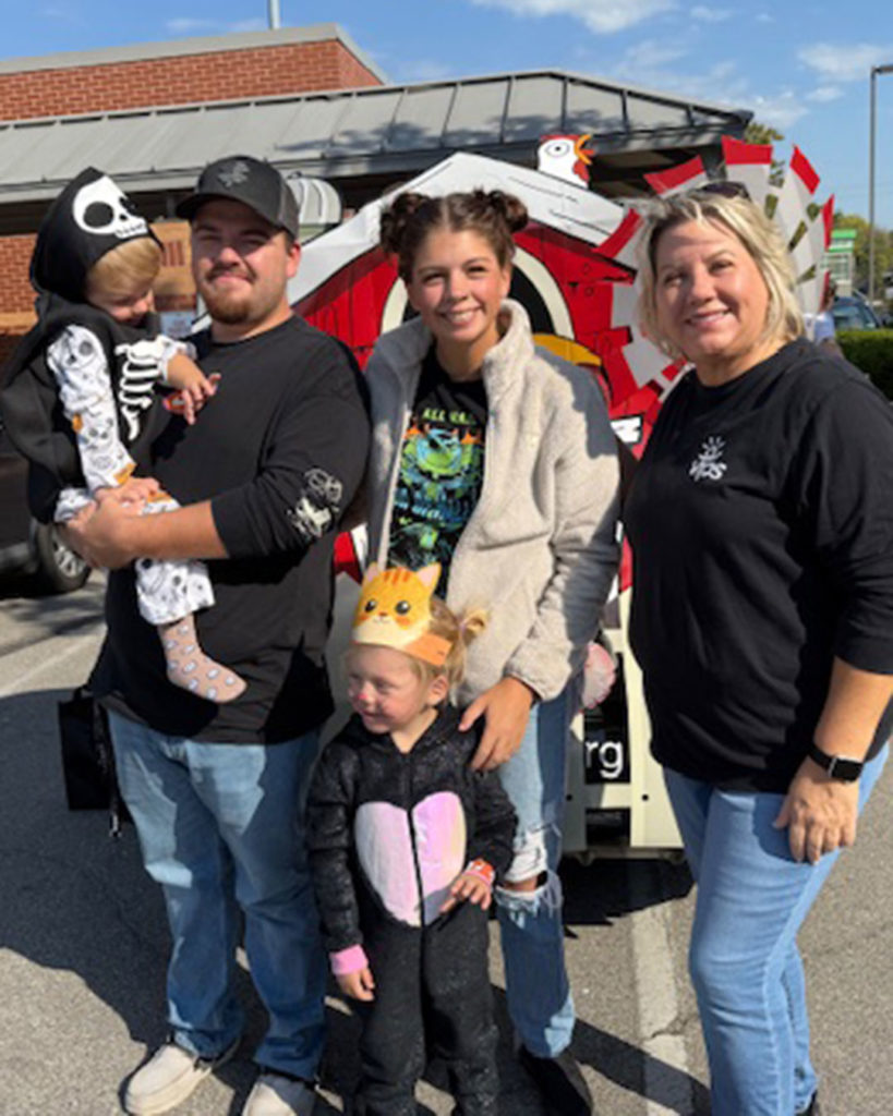 Tammy Maynard and a VIPS family of four pose for a photo.