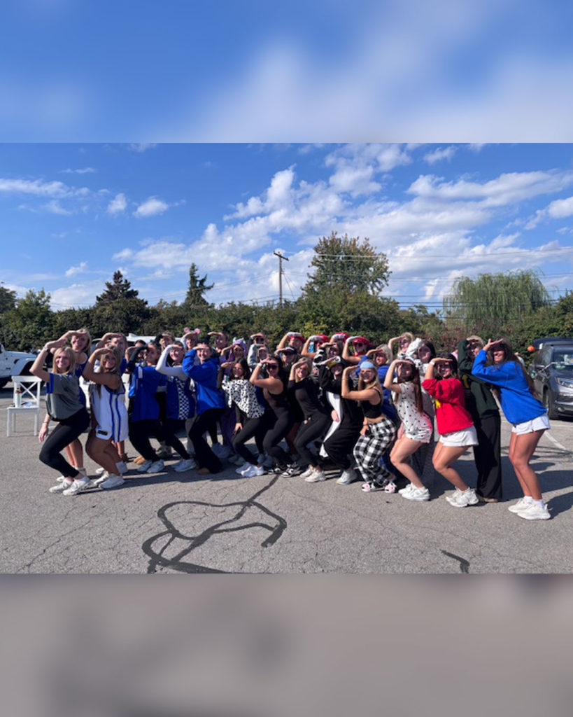 Volunteers from UK Delta Gamma pose for a photo.