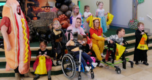 Miss Staci's class poses for a photo on the steps in Kids Town.