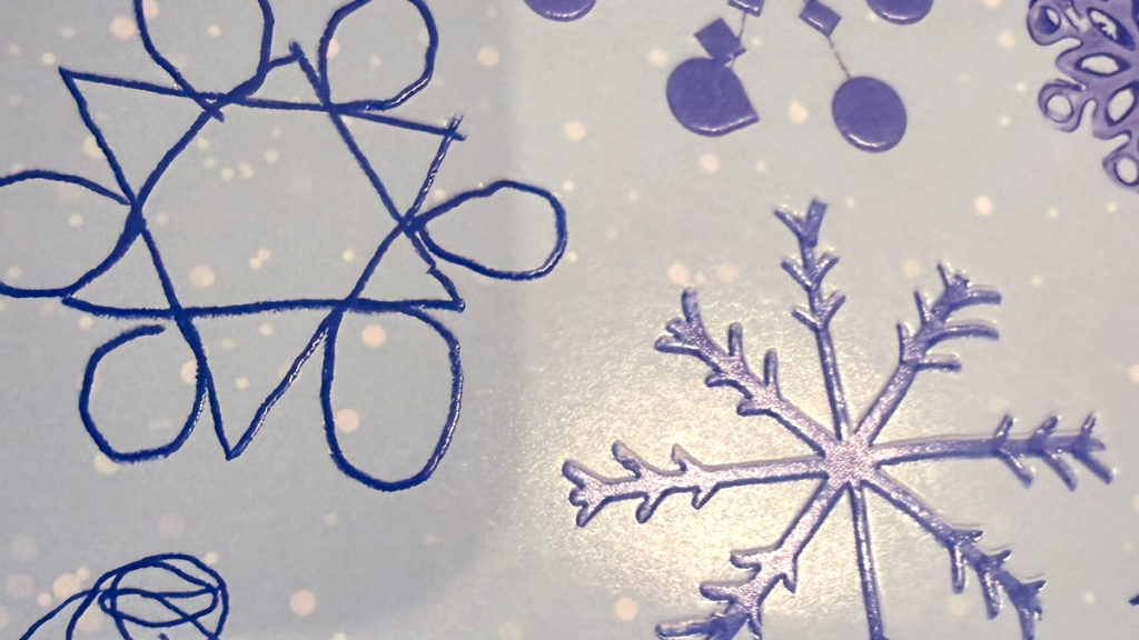 Detail photo of the holiday card highlighting the embossing effect.