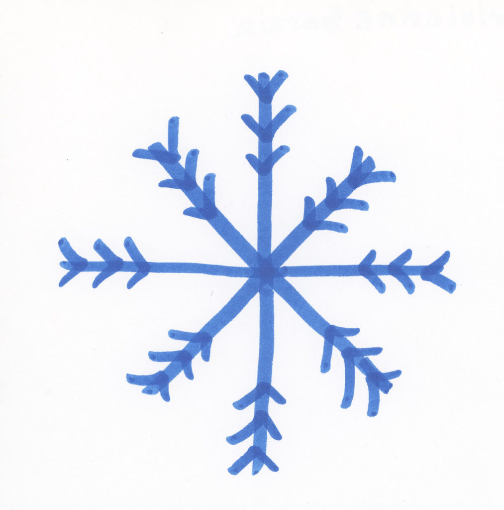 A child-made snowflake with eight points and chevron shapes on the ends pointing toward the center, drawn with a blue marker.