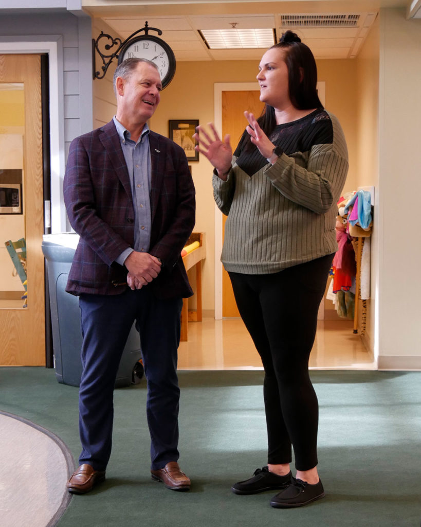 Logan Pichel, President & CEO of Republic Bank, and Lauren Wells, VIPS parent, chat during the reception.