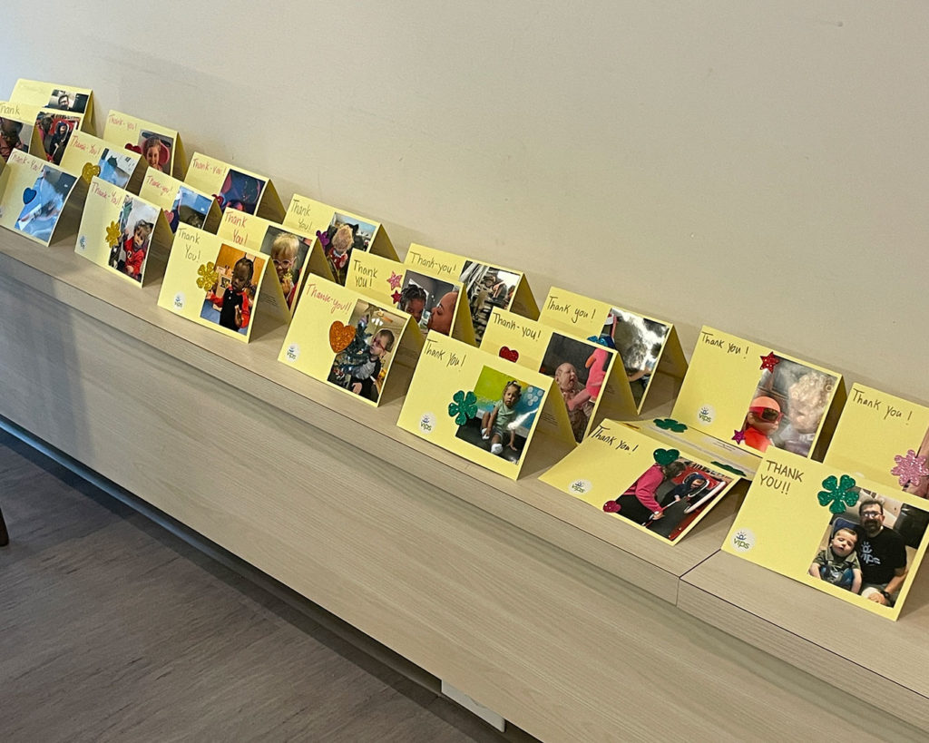 Thank You cards made by the Delta Gammas are lined up on the shelf.