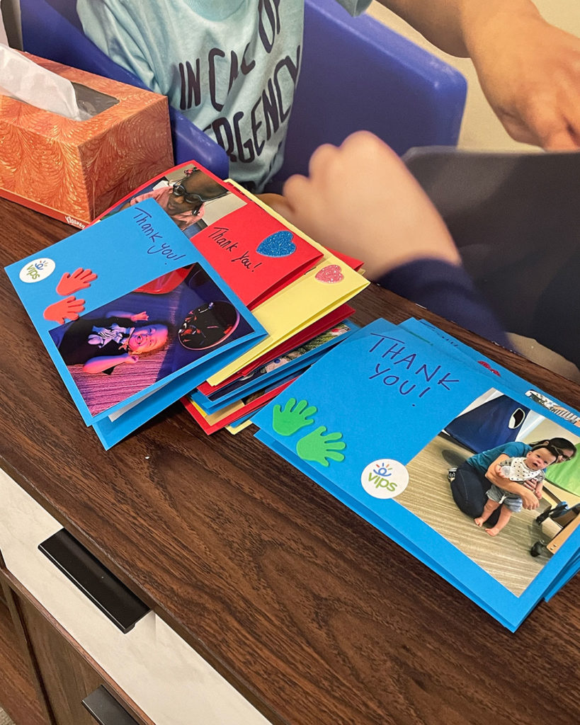 Thank You cards made by the Delta Gammas are stacked on the credenza.