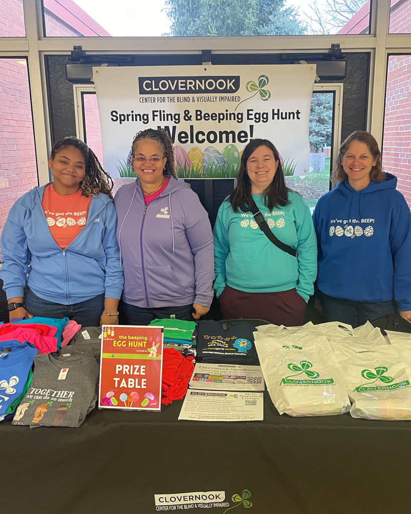 Clovernook staff members pose for a photo at the welcome table.