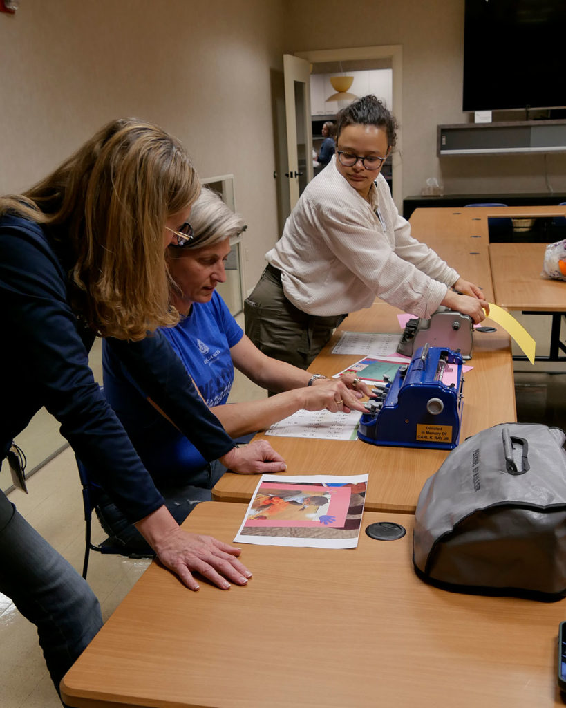 GE volunteers use the braillers.