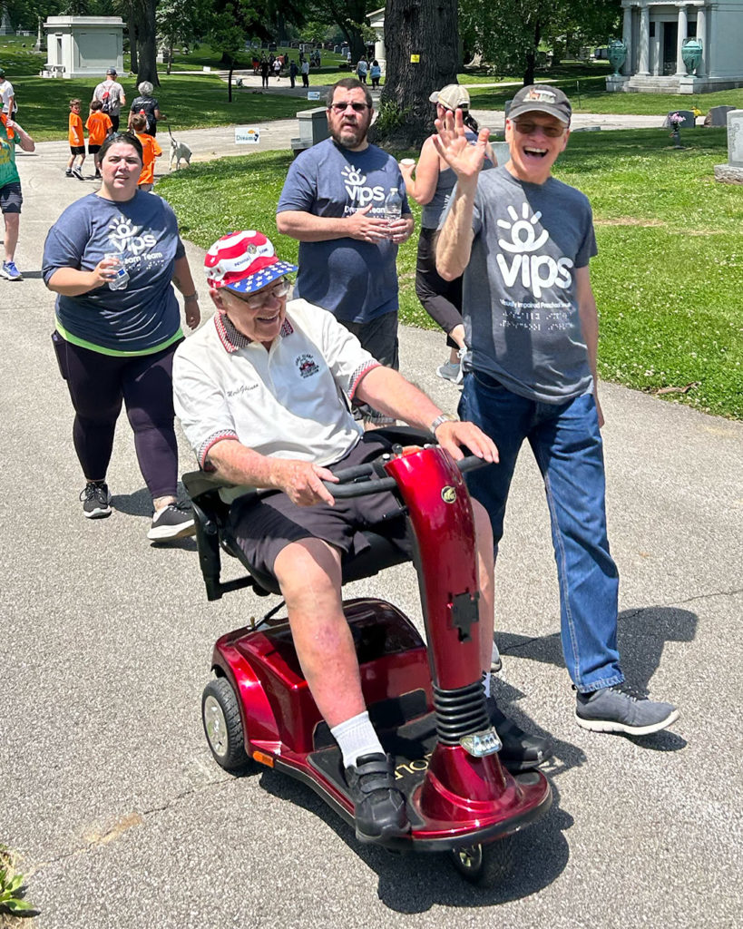A group of VIPS supporters waves at the camera during Walking for Dreams.